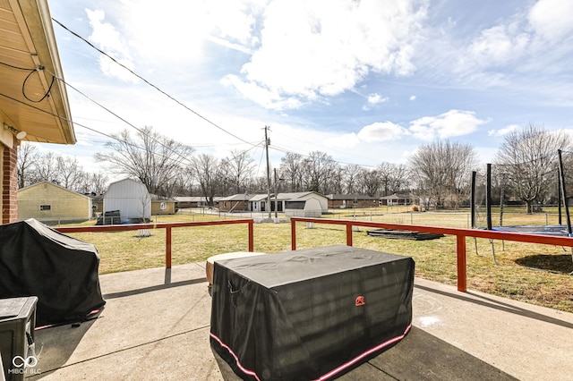 view of patio / terrace with a trampoline and grilling area