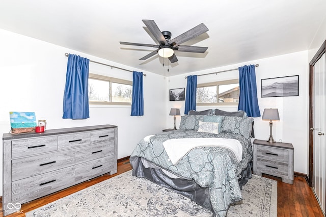 bedroom featuring dark wood-type flooring and ceiling fan