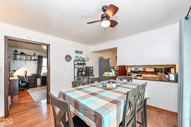 dining room featuring ceiling fan and light hardwood / wood-style floors