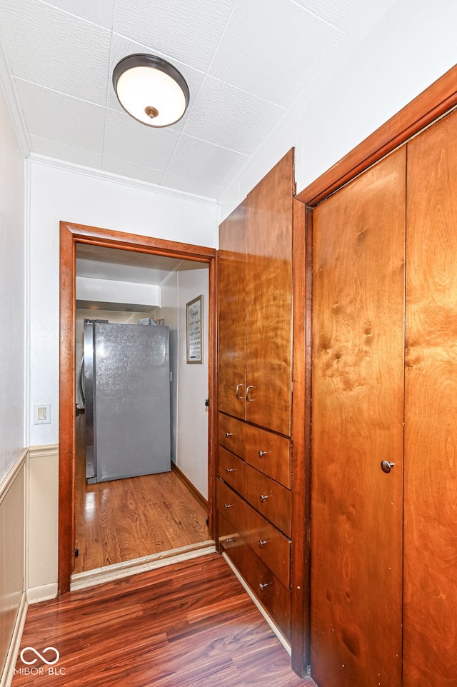 hall with dark hardwood / wood-style flooring