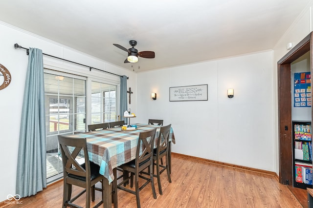 dining room with ceiling fan, crown molding, and light hardwood / wood-style floors