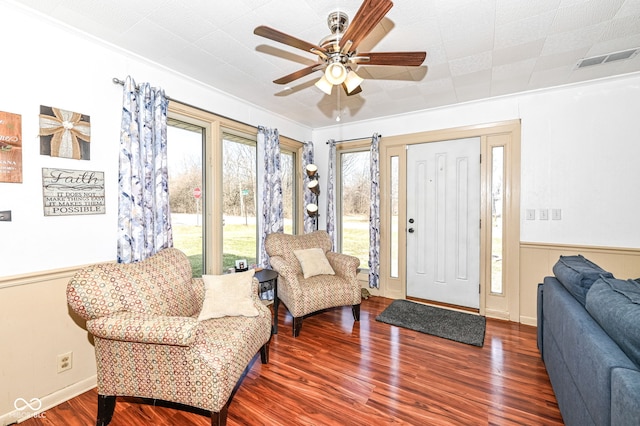 foyer entrance with dark hardwood / wood-style floors and ceiling fan