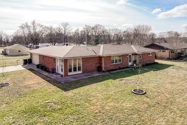 back of property featuring a yard and a patio area