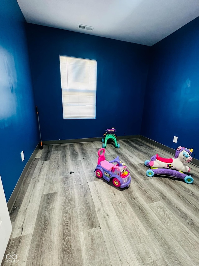 bedroom with hardwood / wood-style floors