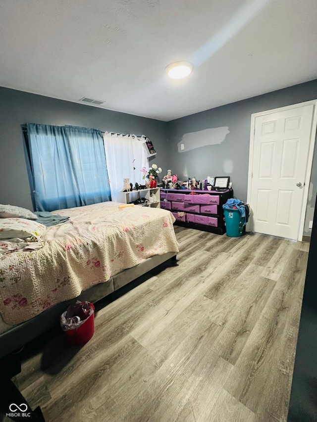 bedroom featuring hardwood / wood-style floors