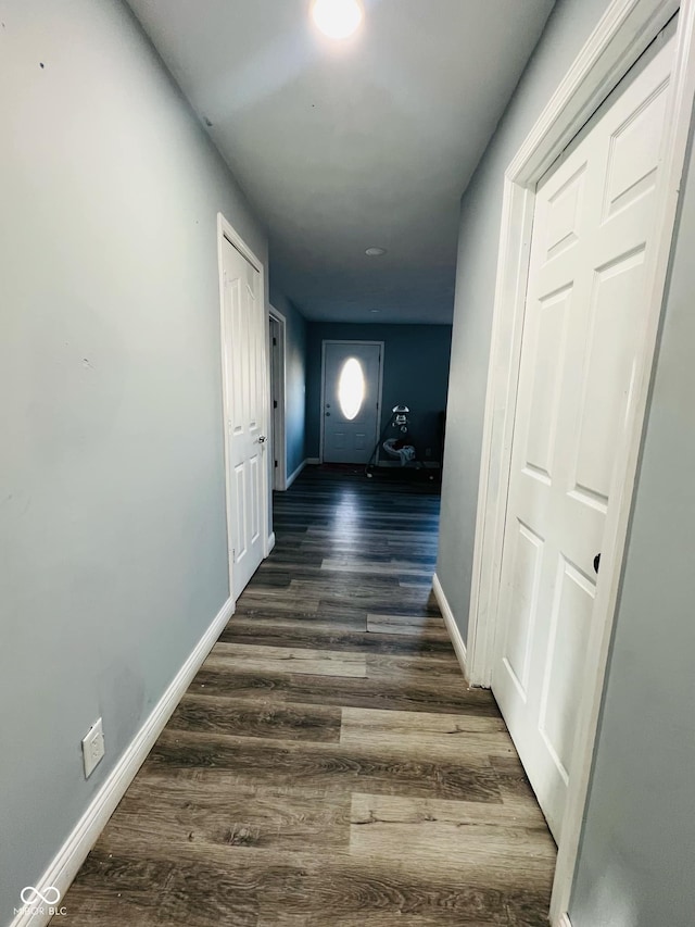 hallway with dark wood-type flooring