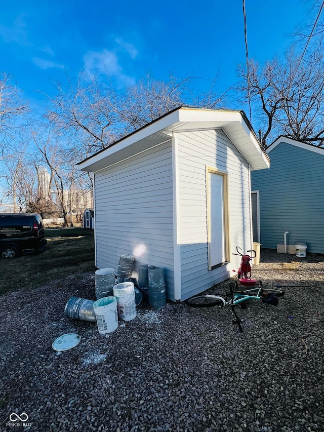 view of home's exterior with a storage unit