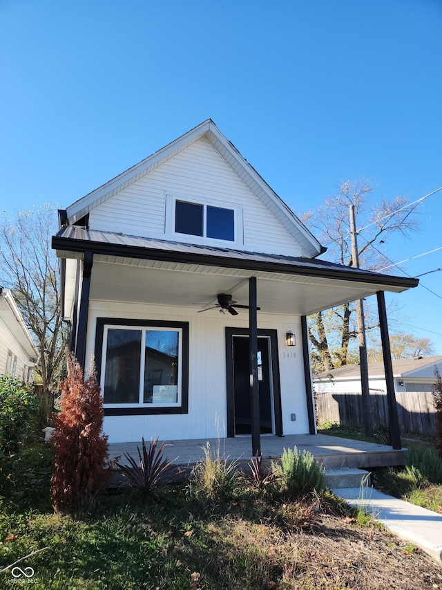 view of front of home featuring ceiling fan and a porch