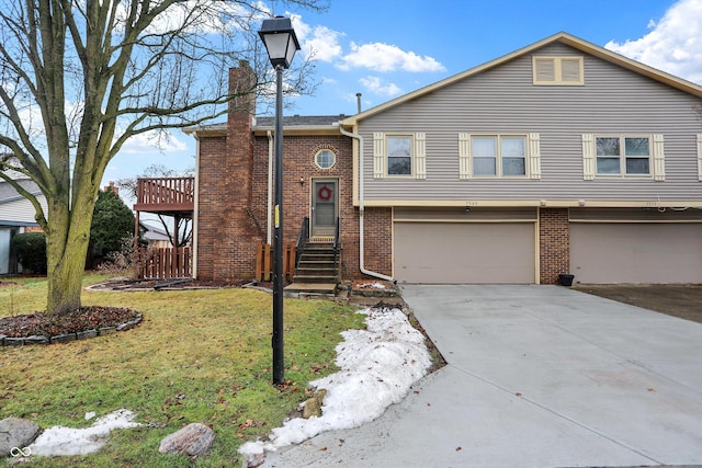 view of front of house with a garage and a front yard