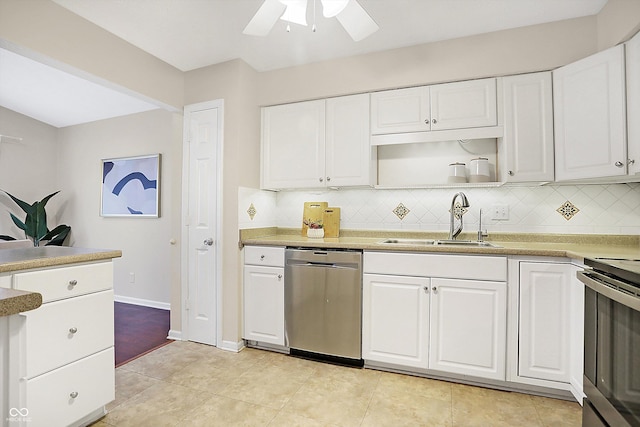 kitchen with white cabinetry, appliances with stainless steel finishes, sink, and decorative backsplash