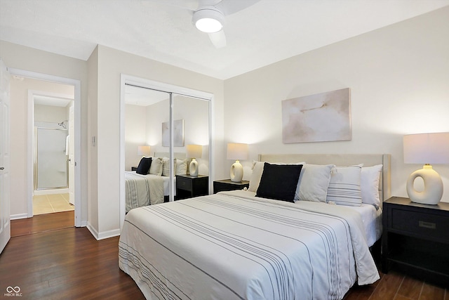 bedroom featuring dark hardwood / wood-style flooring, a closet, and ceiling fan