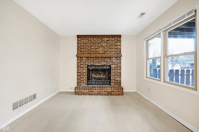 unfurnished living room featuring carpet and a fireplace