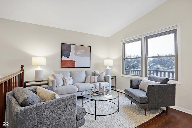 living room with lofted ceiling and hardwood / wood-style floors