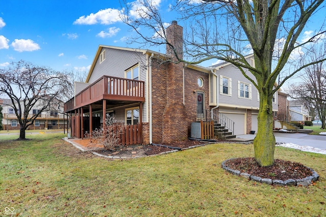 view of side of property featuring a garage and a yard