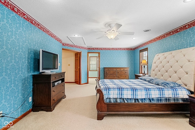 bedroom featuring light carpet, wallpapered walls, visible vents, and baseboards