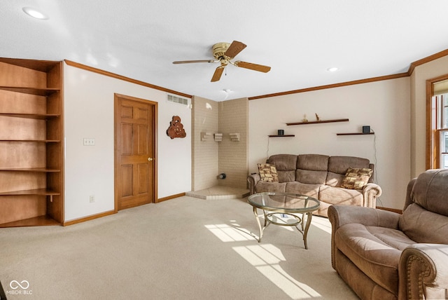 living room with crown molding, visible vents, a ceiling fan, light carpet, and baseboards