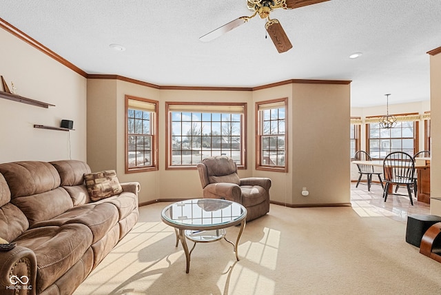 living area featuring light carpet, baseboards, a textured ceiling, and ornamental molding