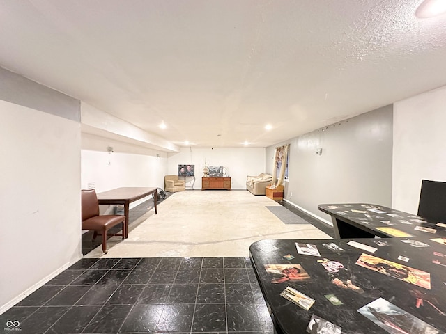 rec room with a textured ceiling