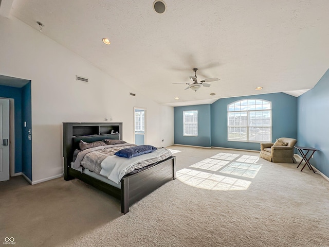 bedroom with ceiling fan, high vaulted ceiling, light carpet, and a textured ceiling