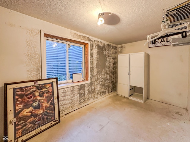 empty room with a textured ceiling