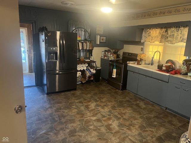 kitchen featuring range with electric cooktop, sink, gray cabinetry, and stainless steel fridge with ice dispenser