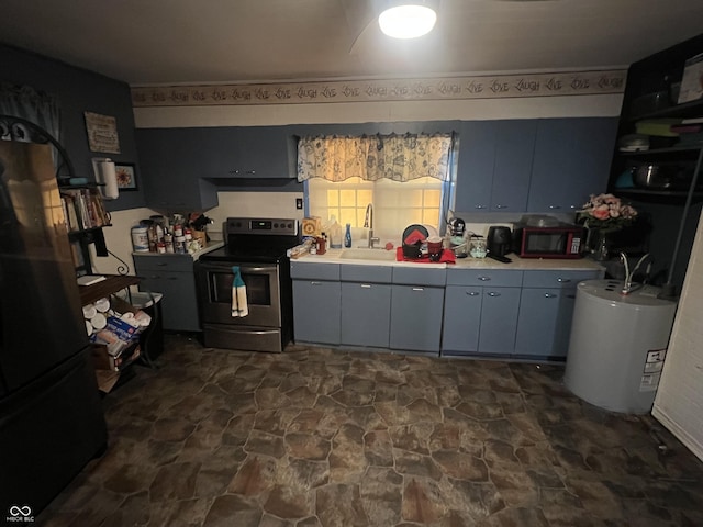 kitchen with sink, black fridge, electric water heater, and stainless steel electric range oven