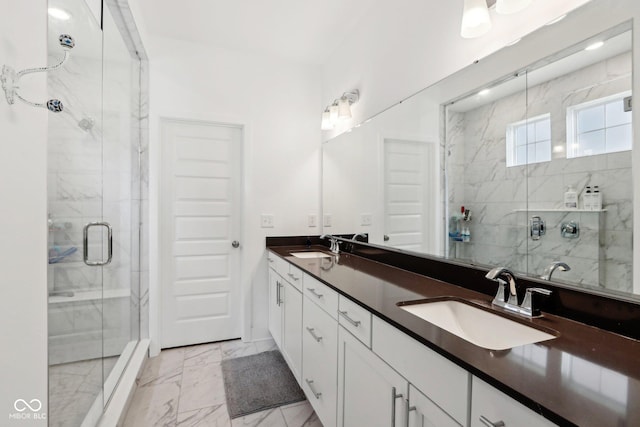 bathroom featuring an enclosed shower and vanity