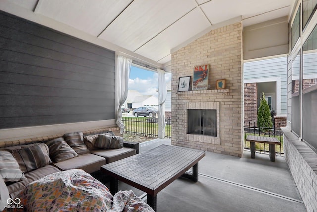 view of patio / terrace featuring an outdoor living space with a fireplace