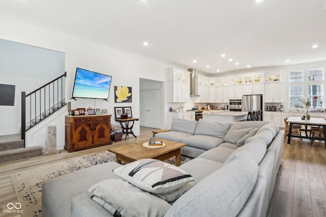 living room featuring ornamental molding and hardwood / wood-style floors