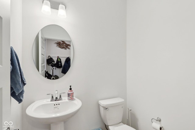 bathroom with toilet and sink