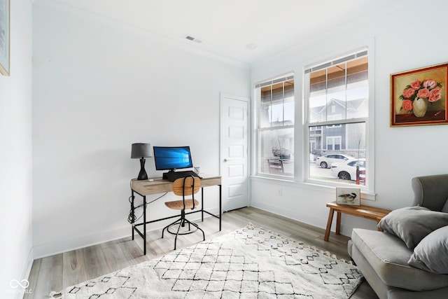 office space with light hardwood / wood-style floors