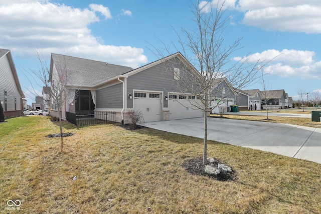 view of front of home featuring a garage and a front yard