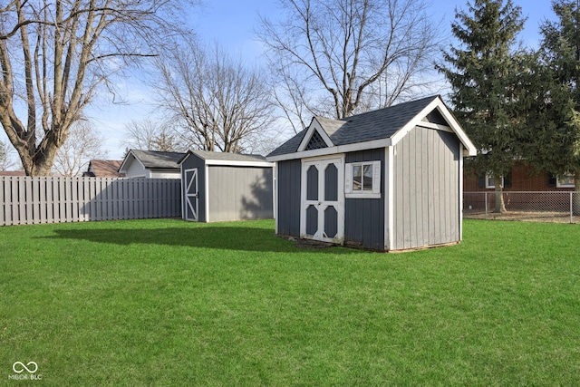 view of outdoor structure featuring a lawn