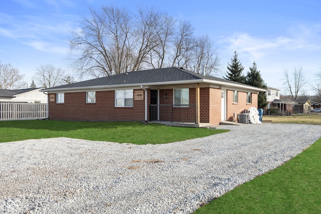 ranch-style house with a front lawn