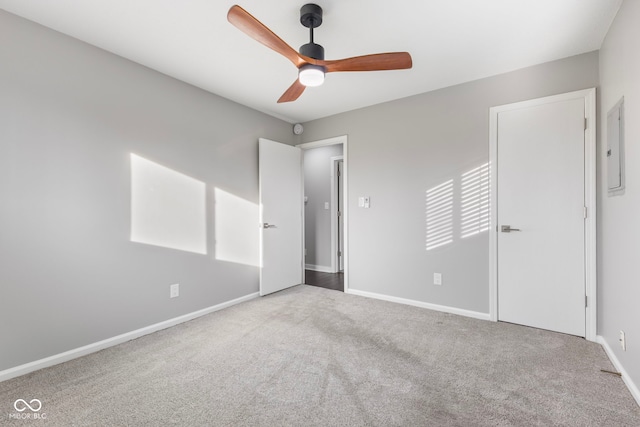 unfurnished bedroom with ceiling fan and carpet flooring