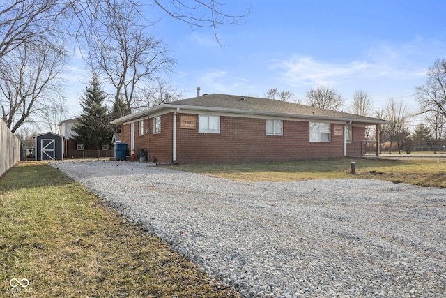 view of property exterior featuring a storage shed and a yard