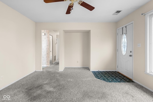 carpeted foyer entrance with plenty of natural light