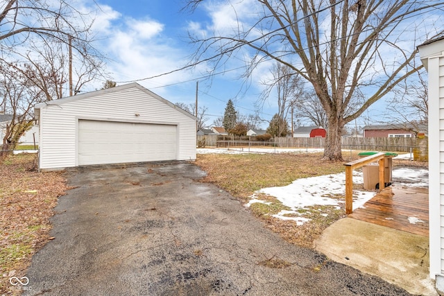 view of yard featuring a garage and an outbuilding