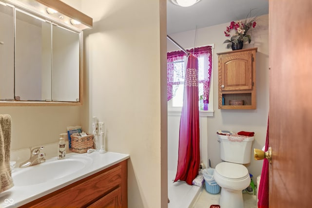 bathroom with vanity, toilet, and a shower with shower curtain