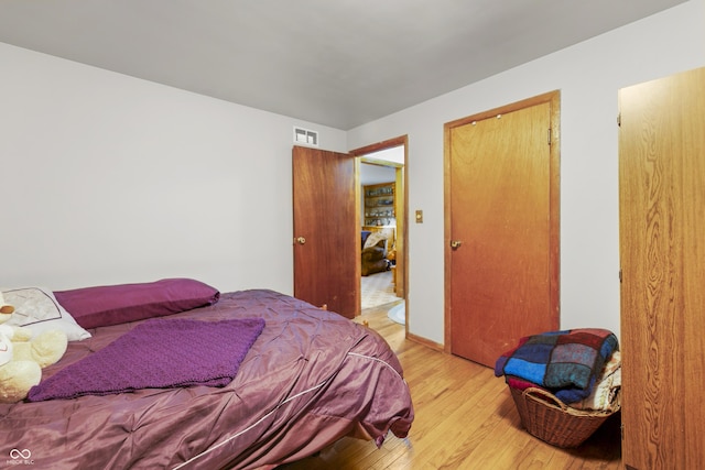 bedroom with light wood-type flooring