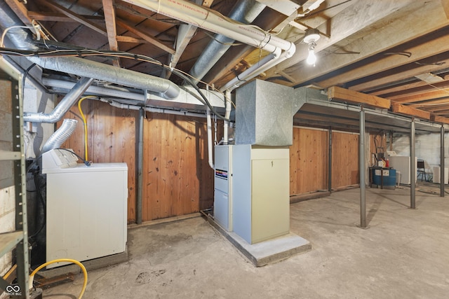 basement featuring washer / clothes dryer and heating unit