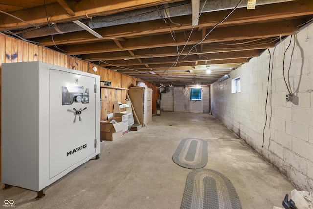 basement featuring refrigerator