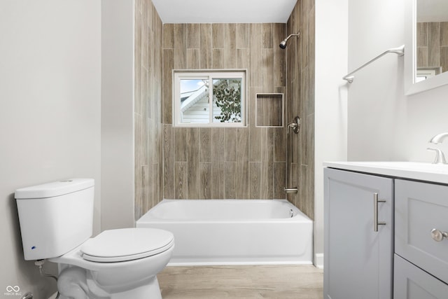 full bathroom featuring vanity, toilet, and tiled shower / bath combo