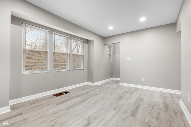 unfurnished room with light hardwood / wood-style flooring