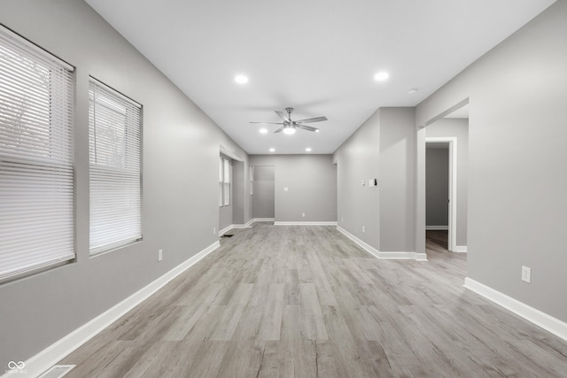 unfurnished room featuring ceiling fan and light hardwood / wood-style floors