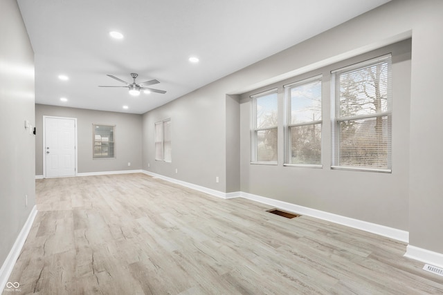 spare room with ceiling fan and light hardwood / wood-style flooring