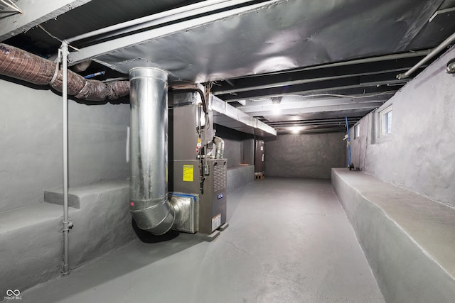 basement featuring heating unit