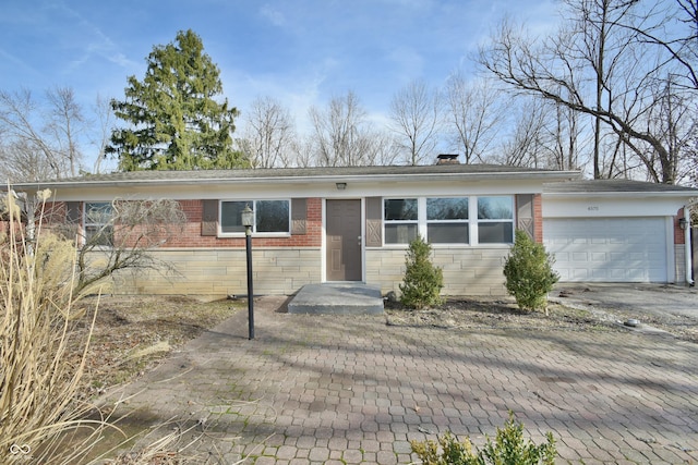 single story home featuring a garage