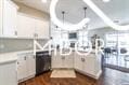 kitchen with dark hardwood / wood-style flooring and white cabinets