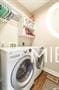 clothes washing area with washing machine and clothes dryer